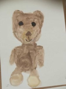 brązowy uśmiechnięty miś